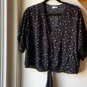 Black loose fitting shirt w/ a blue floral print